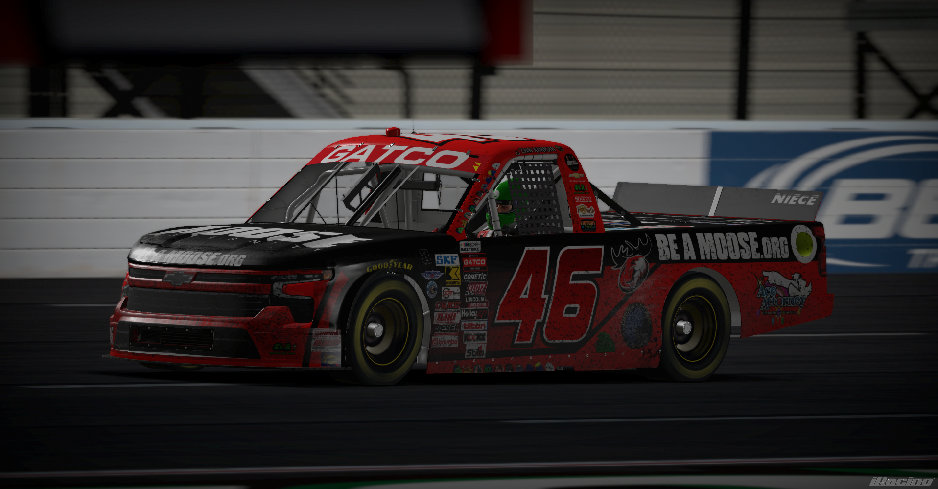 Red and black number 46 Be a Moose truck on track