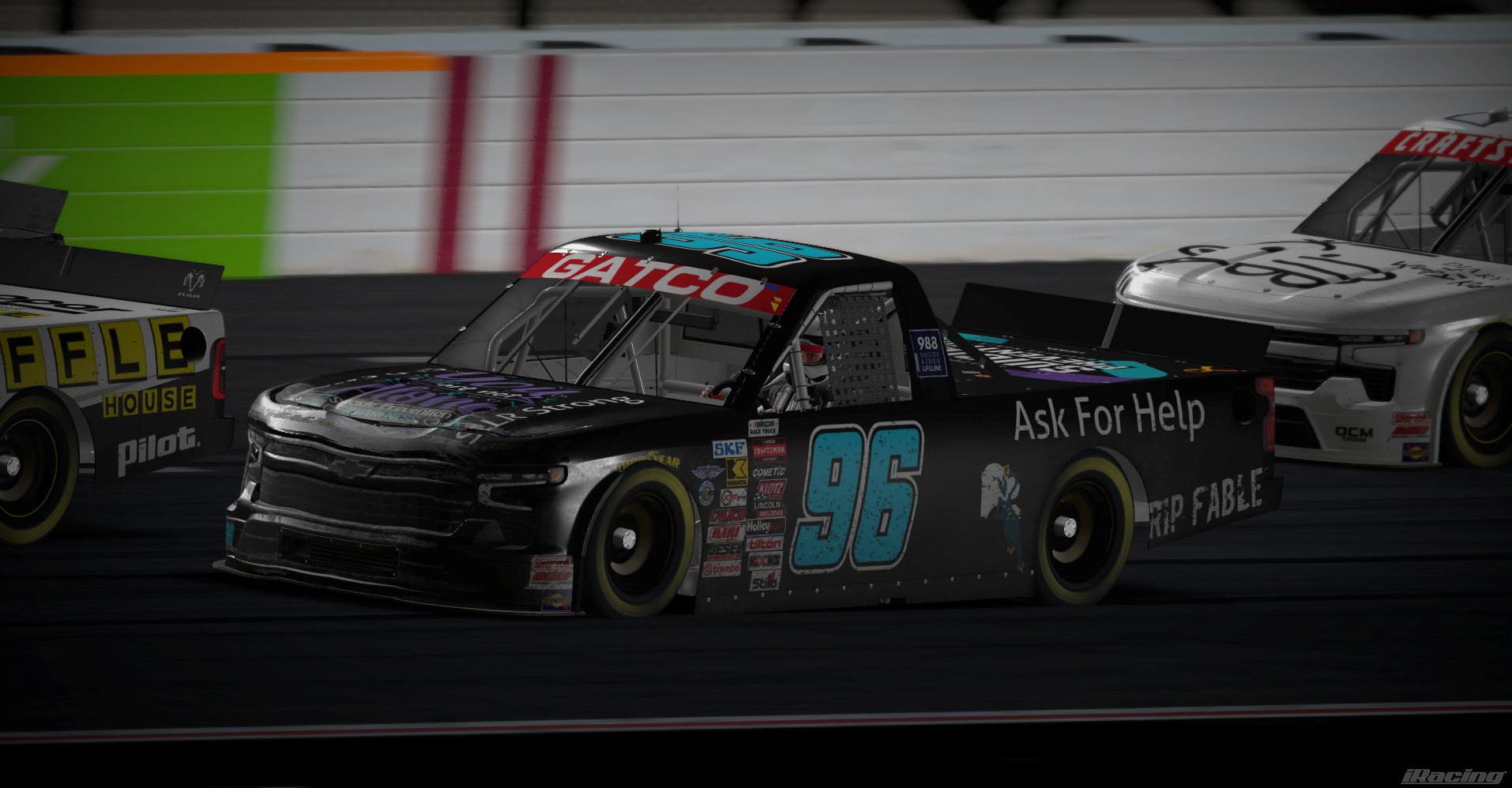 Number 96 Ask For Help truck racing in the pack