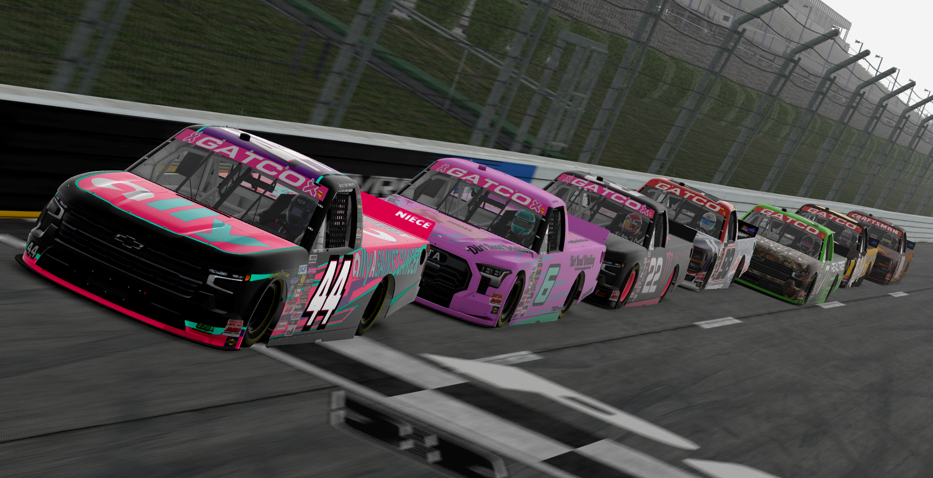 Number 44 Ally Against Cancer truck leading a line of trucks